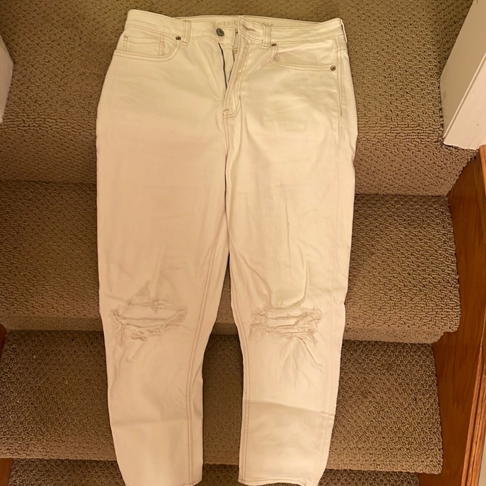White Ripped American Eagle Jeans with Brown Stitching